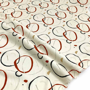 Print Linen Fabric with abstract pattern of circles on a cream background - Fabric Collection