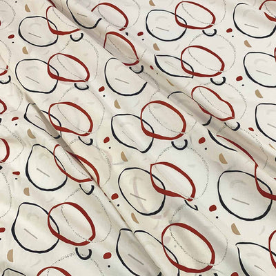Linen fabric with abstract circle pattern of deep red, navy, and beige circular shapes on a cream background - Fabric Collection