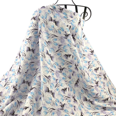 Floral Blue Tulip Bud Printed Linen Fabric design draped against a white background