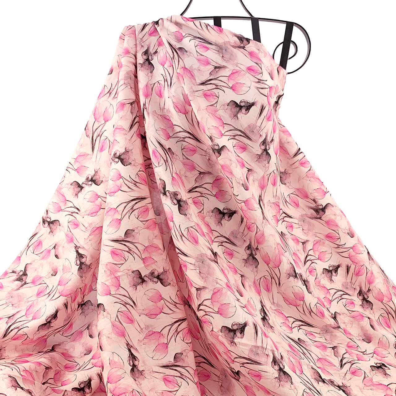 Printed Linen Tulip Pink floral patterned fabric draped against a white background - Fabric Collection