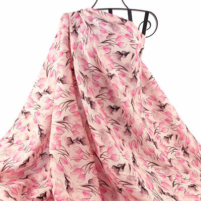 Printed Linen Tulip Pink floral patterned fabric draped against a white background - Fabric Collection