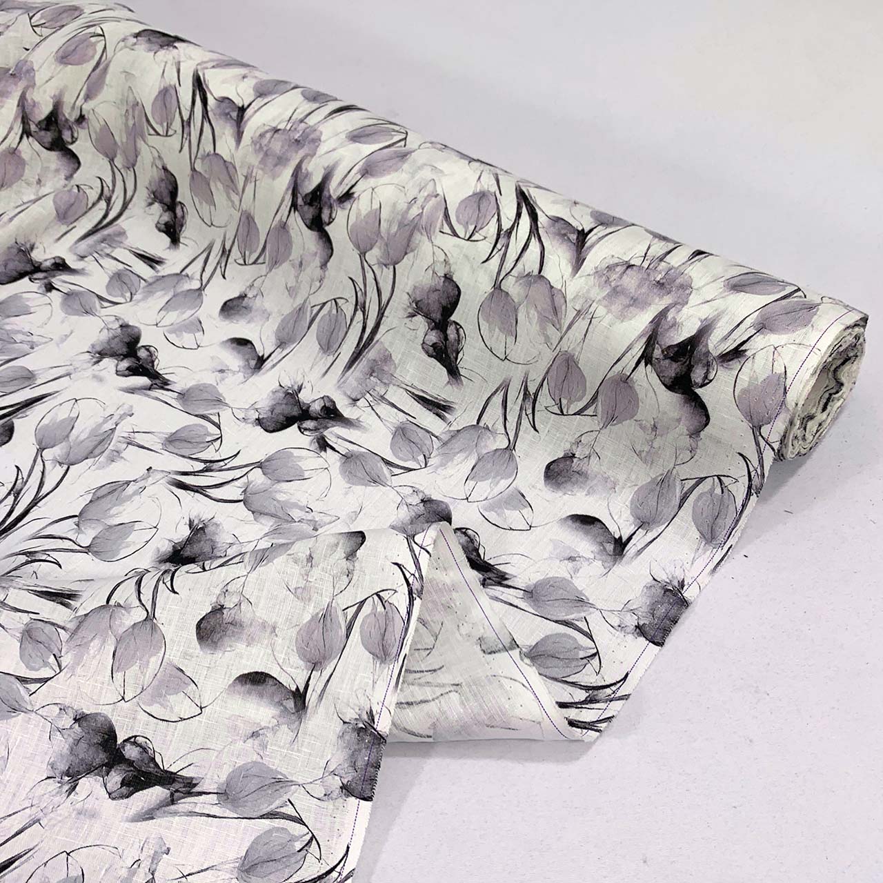 Roll of floral tulip linen fabric design on a white background - Fabric Collection