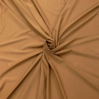 Close-up of bronze brown bamboo knit fabric with a knot - Fabric Collection