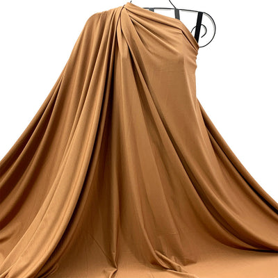 Bronze Brown bamboo fabric draped over a mannequin on a white background - Fabric Collection