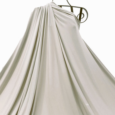 Beige bamboo jersey knit fabric, soft, breathable and eco-friendly draped on mannequin- Fabric Collection