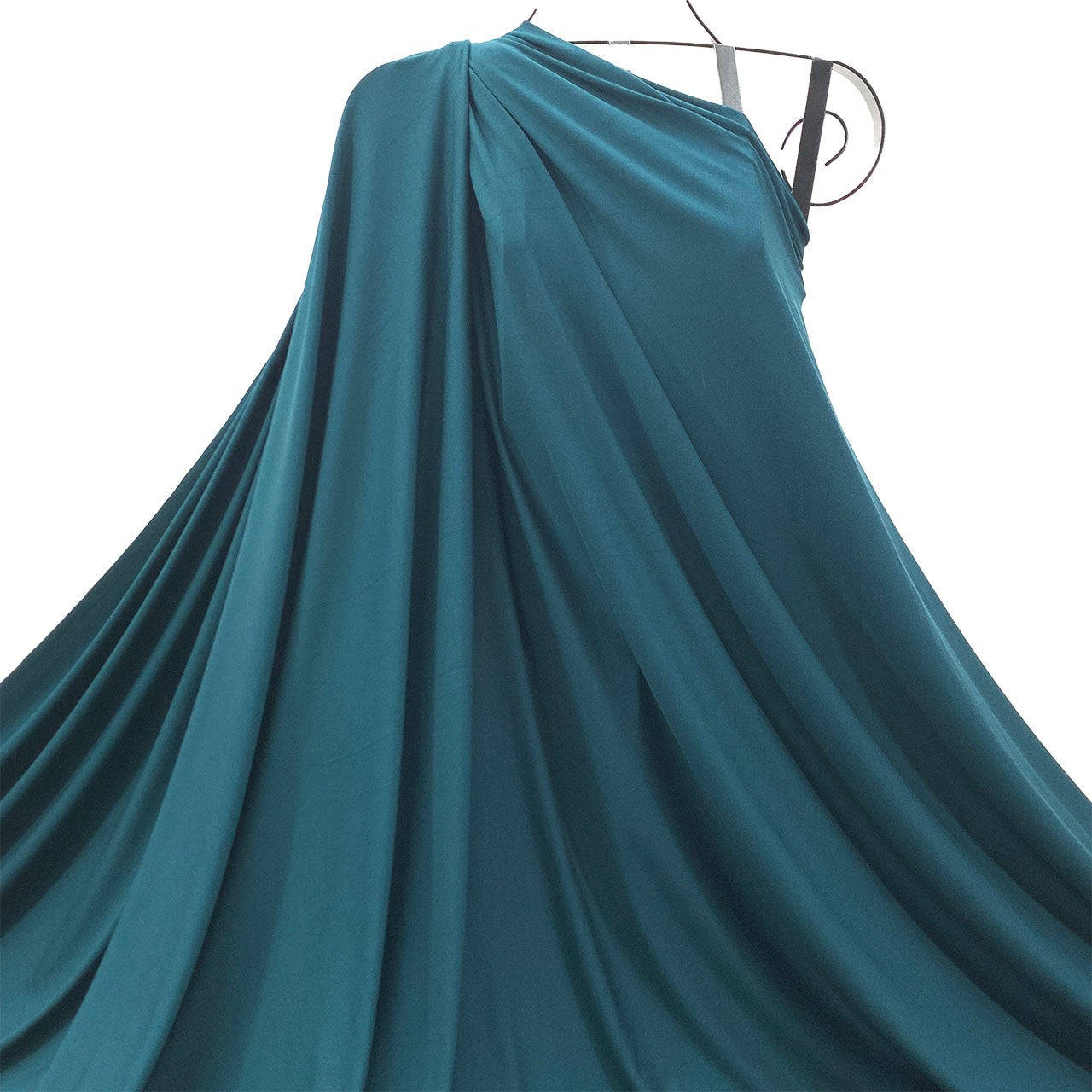 Teal Spruce Green bamboo jersey knit fabric draped as one-shoulder on a mannequin against a white background