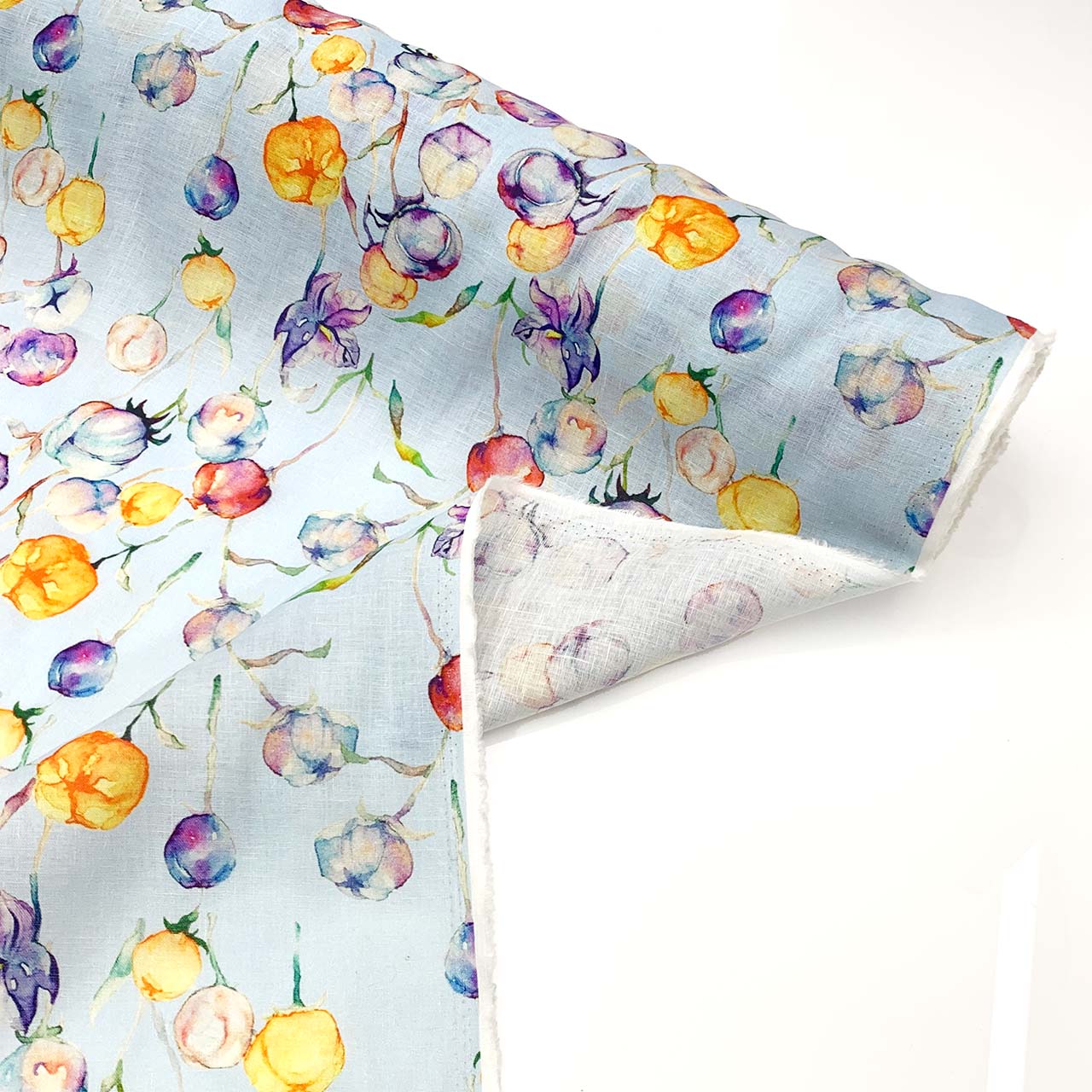 Floral linen patterned fabric with colorful flowers on a white background
