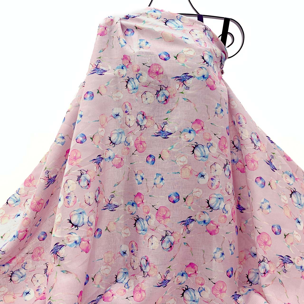 Floral-patterned linen fabric on a hanger with a white background - Fabric Collection