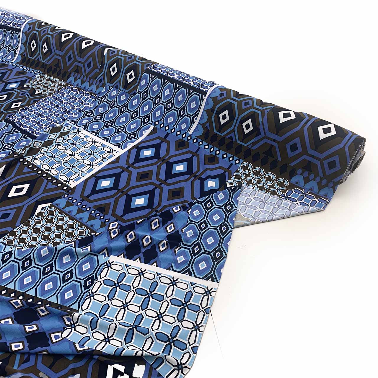 Jersey knit blue geometric patterned fabric  on a white background - Fabric Collection