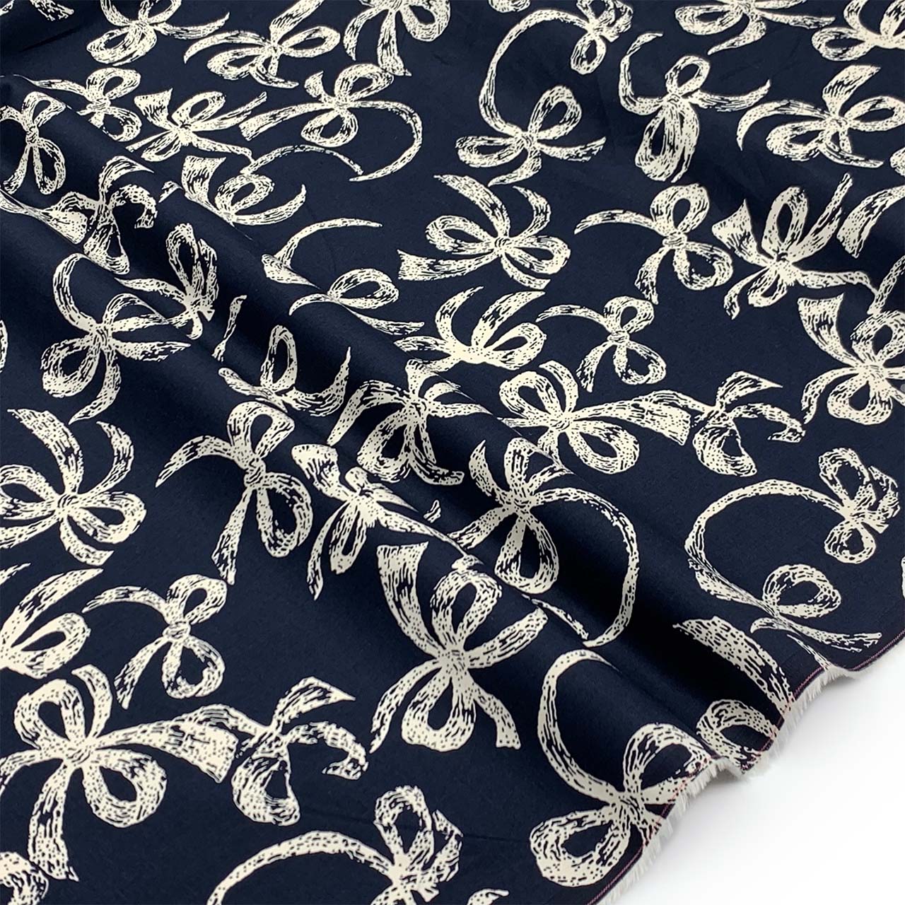 cotton sateen navy fabric printed cream bows