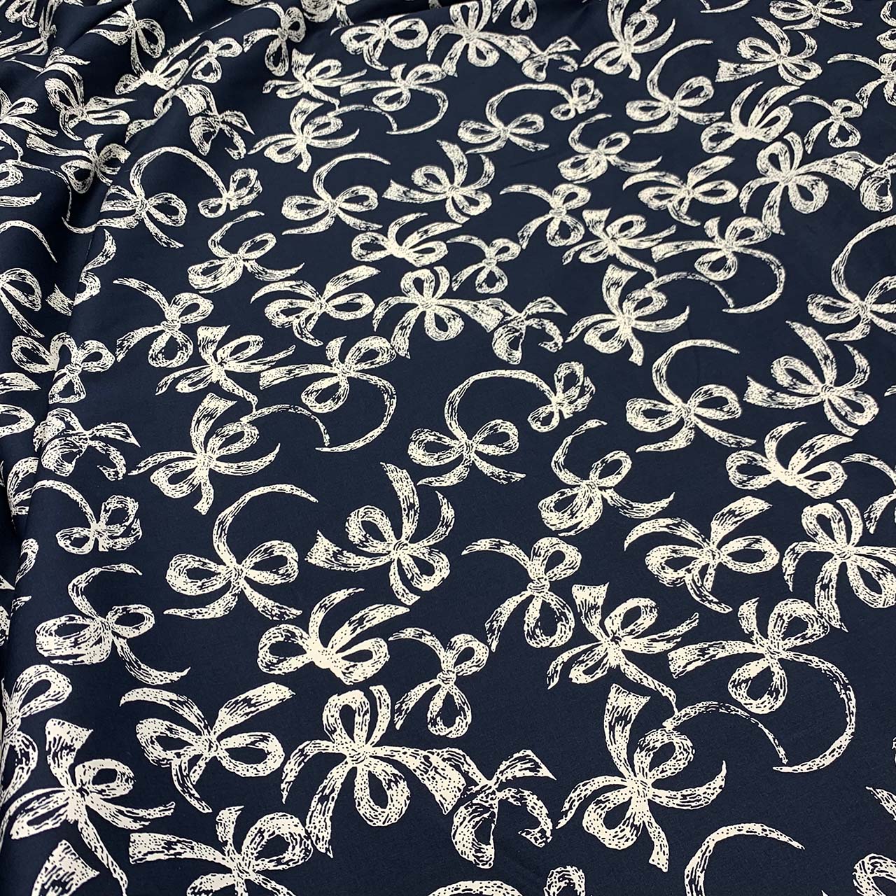 cotton sateen navy fabric printed cream bows