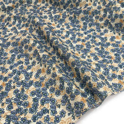 printed linen fabric dainty blue beige flowers on a beige background natural fibre fabric