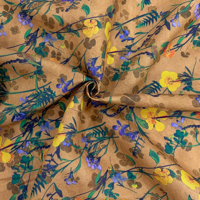 printed linen floral pattern in yellow blue colours on a nude tan 