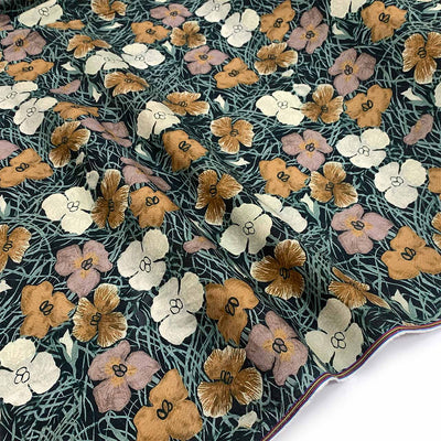 beige tan floral pattern printed on forest green natural fibre linen material